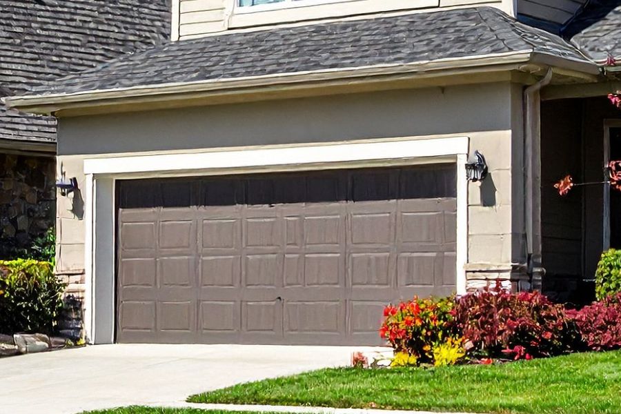Residential garage door in Arcola VA representing Door Doctor repair and installation services
