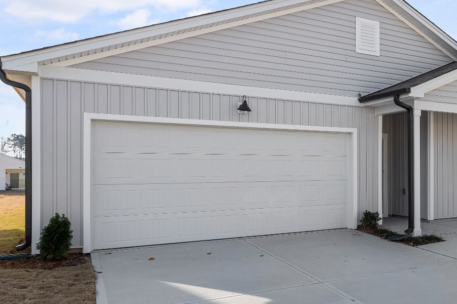 Residential garage door in Ashburn VA representing Door Doctor repair and installation services