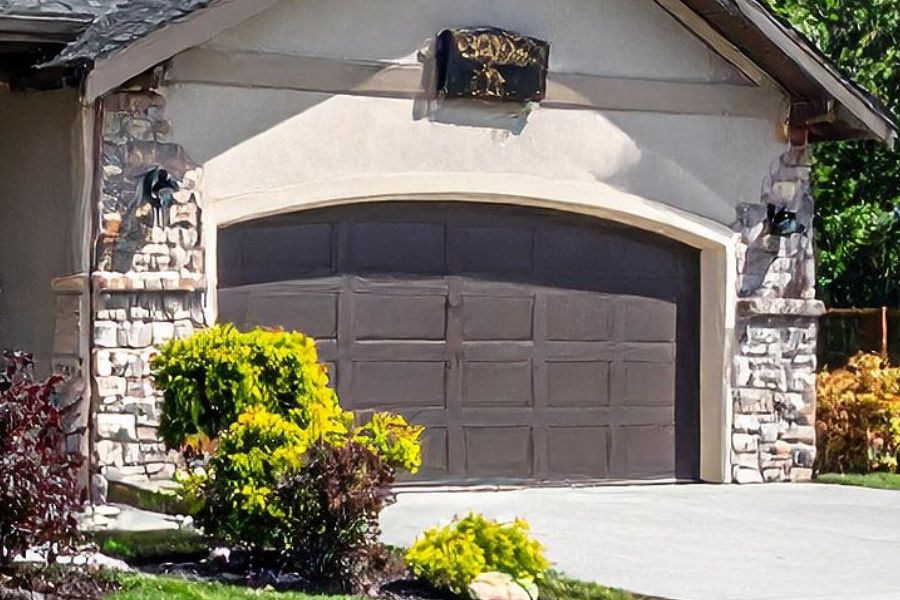 Residential garage door in Bristow VA representing Door Doctor repair and installation services
