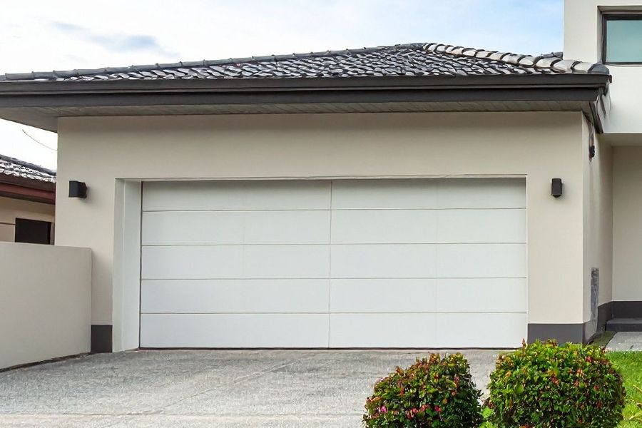 Residential garage door in Fair Oaks VA representing Door Doctor repair and installation services
