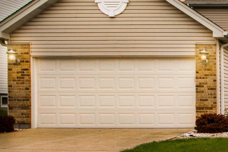 Residential garage door in Sterling VA representing Door Doctor repair and installation services
