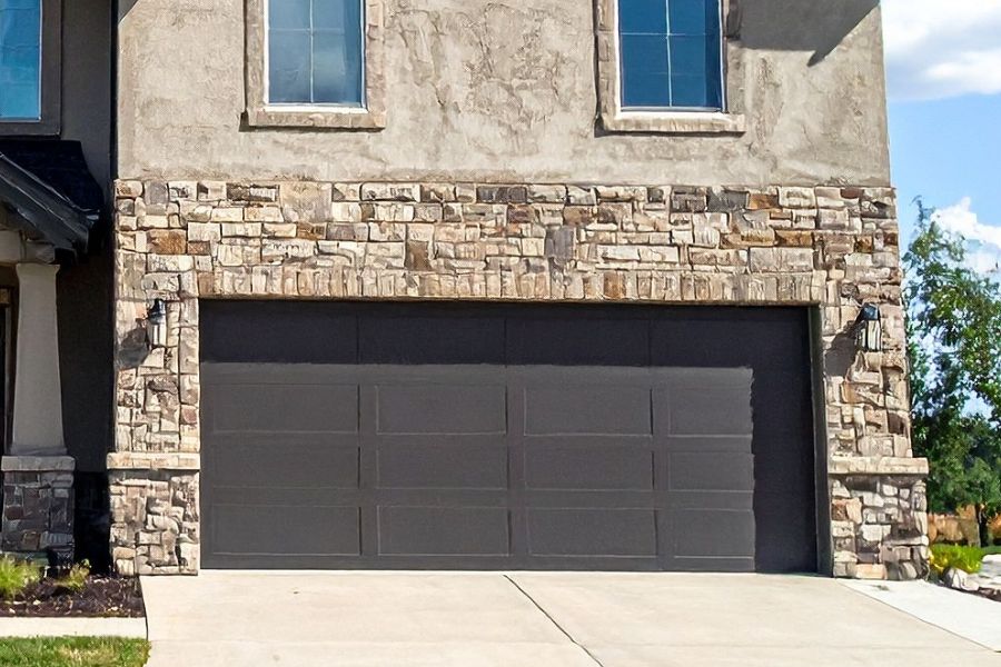 Residential garage door in Tysons VA representing Door Doctor repair and installation services
